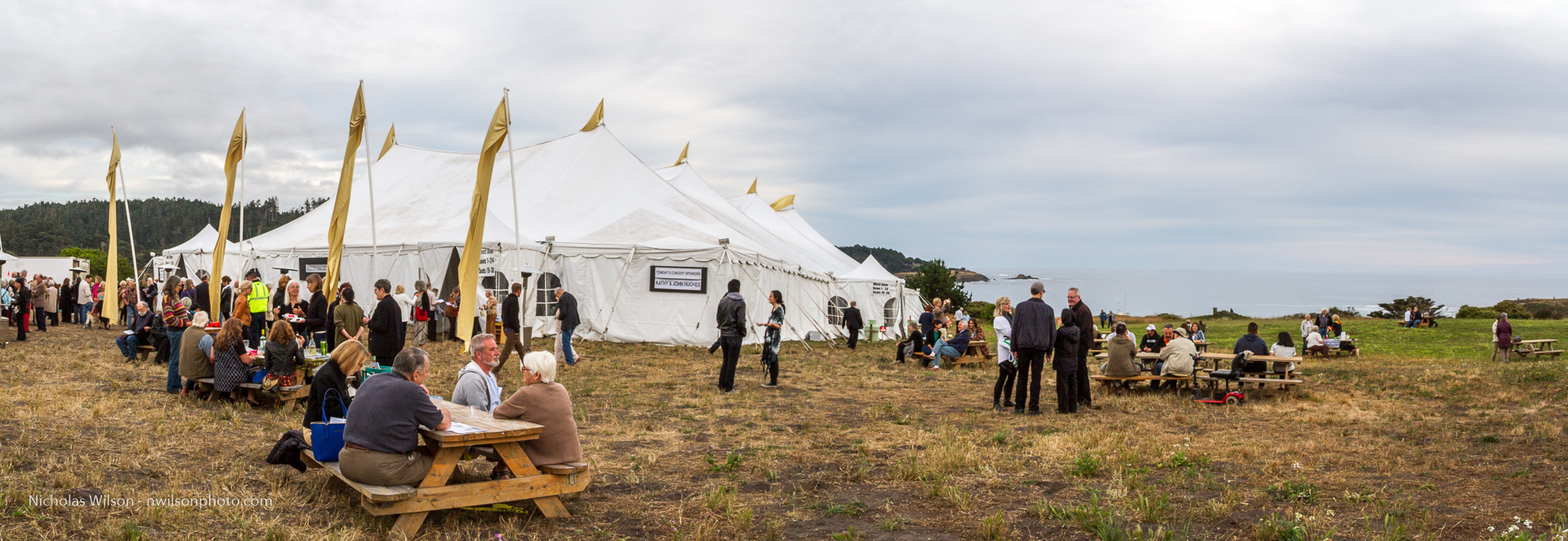 Audience members picnic outside the 800 seat tent concert hall before the opening concert July 11, 2015.
