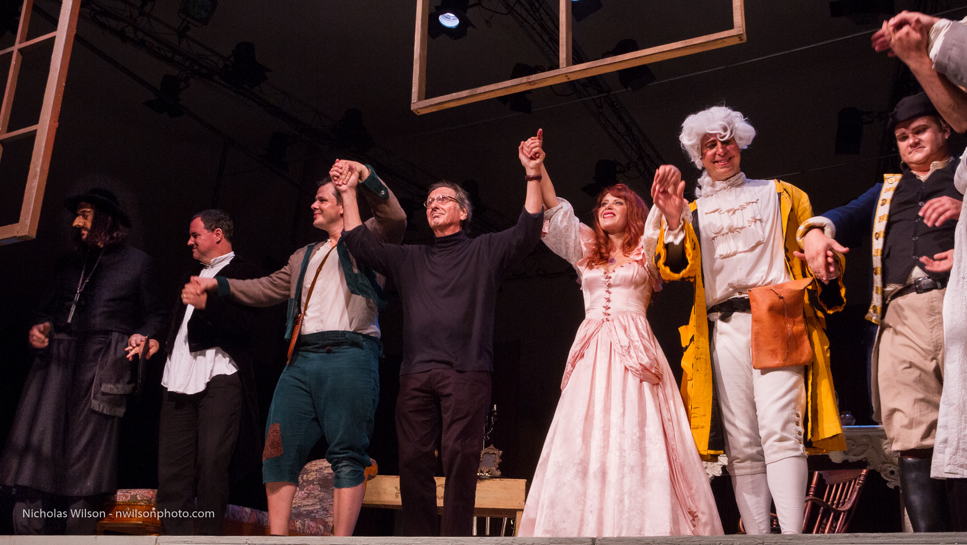 Maestro Allan Pollack joins the cast of The Barber of Seville to acknowledge a standing ovation.