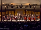 The festival orchestra stands to acknowledge applause at the start of the opening concert