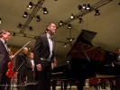 Piano soloist Spencer Myer acknowledges welcoming applause